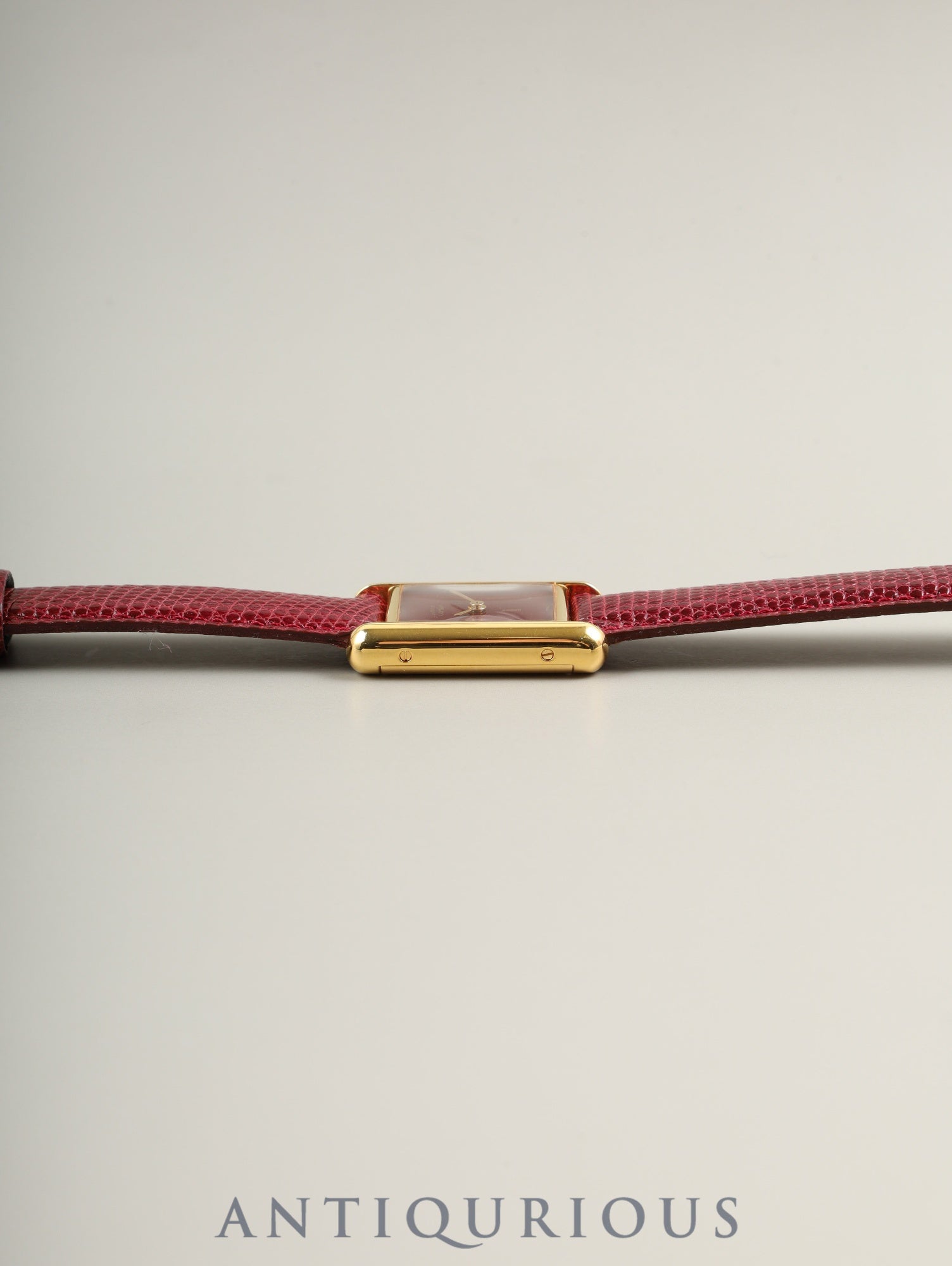 Cartier Must Tank SM, manual winding, SV925, leather, genuine buckle (GP), Bordeaux dial, garnet dial, box, booklet, international lifetime warranty (1984), fully serviced at a Cartier boutique