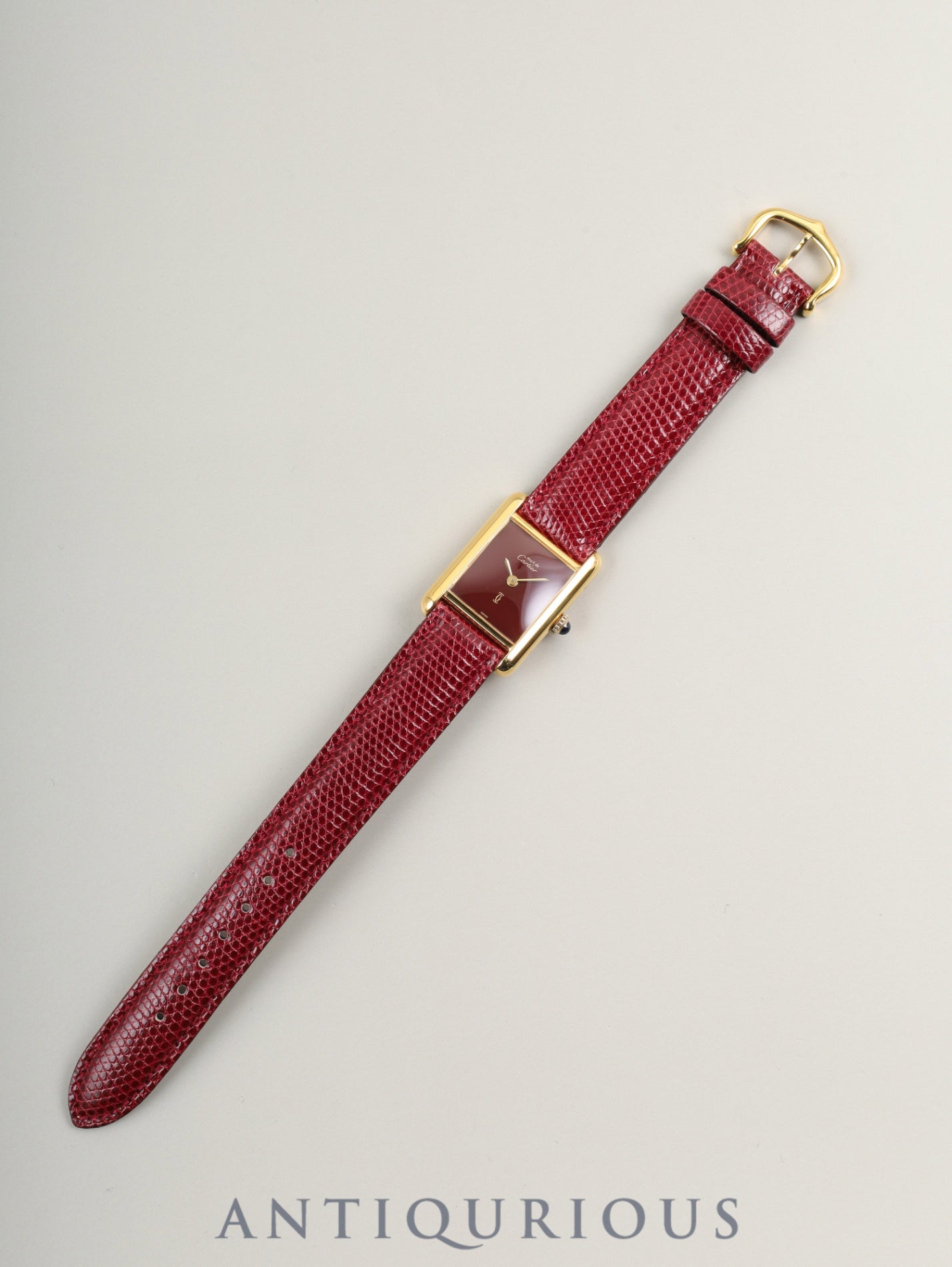 Cartier Must Tank SM, manual winding, SV925, leather, genuine buckle (GP), Bordeaux dial, garnet dial, box, booklet, international lifetime warranty (1984), fully serviced at a Cartier boutique