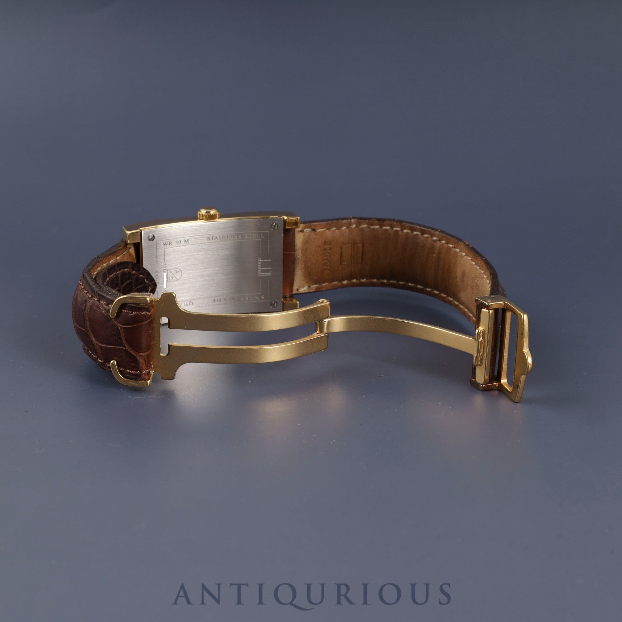 Dunhill Dunhillion Quartz GP with genuine leather strap and genuine D-buckle (GP), white dial, box and booklet, overhauled.