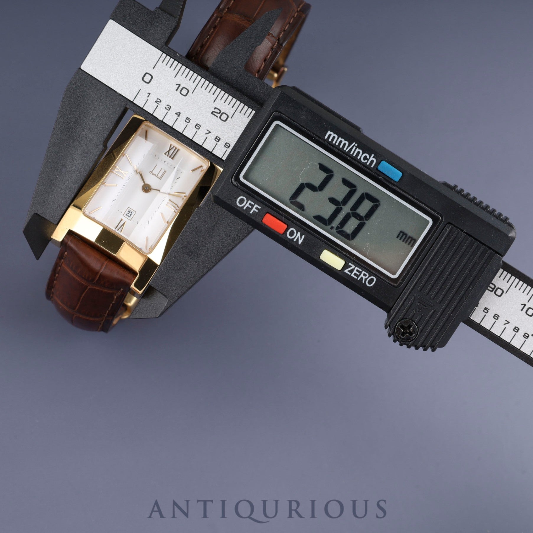 Dunhill Dunhillion Quartz GP with genuine leather strap and genuine D-buckle (GP), white dial, box and booklet, overhauled.