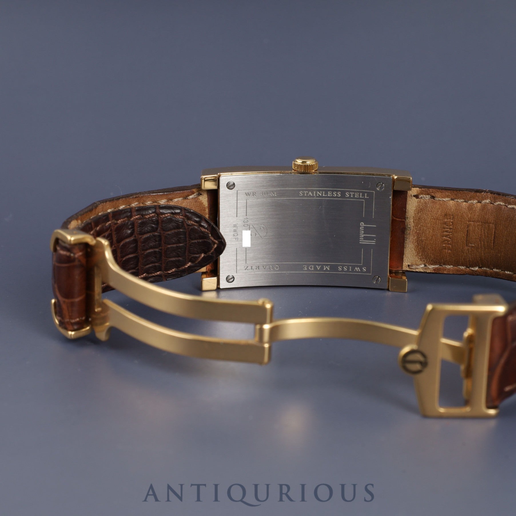 Dunhill Dunhillion Quartz GP with genuine leather strap and genuine D-buckle (GP), white dial, box and booklet, overhauled.