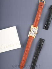 Cartier Tank Américaine MM W2603556 / 2483, Automatic Cal. 077, 18K Yellow Gold (750YG), original leather strap, original 18K Yellow Gold (750YG) pin buckle, white Roman numeral dial (SWISS MADE), booklets, includes original leather strap, overhauled.
