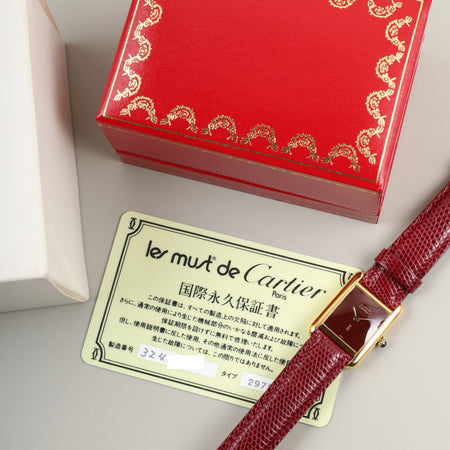 Cartier Must Tank SM, manual winding, SV925, leather, genuine buckle (GP), Bordeaux dial, garnet dial, box, booklet, international lifetime warranty (1984), fully serviced at a Cartier boutique