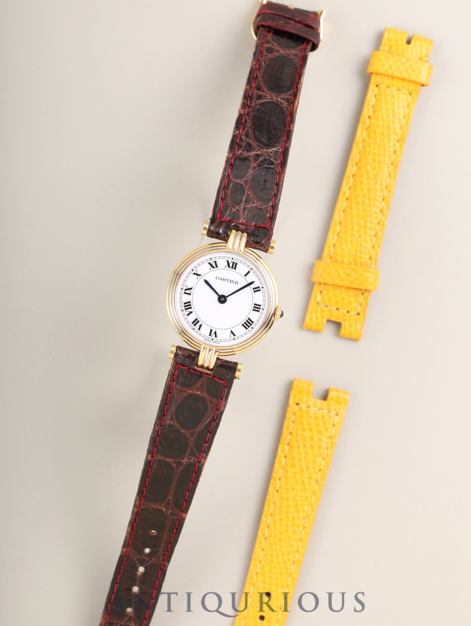 Cartier Vendôme Trinity VLC SM 81004 Quartz Caliber 690 750 with genuine leather strap and genuine buckle (GP). White Roman dial with genuine strap. (Unused) Overhauled.