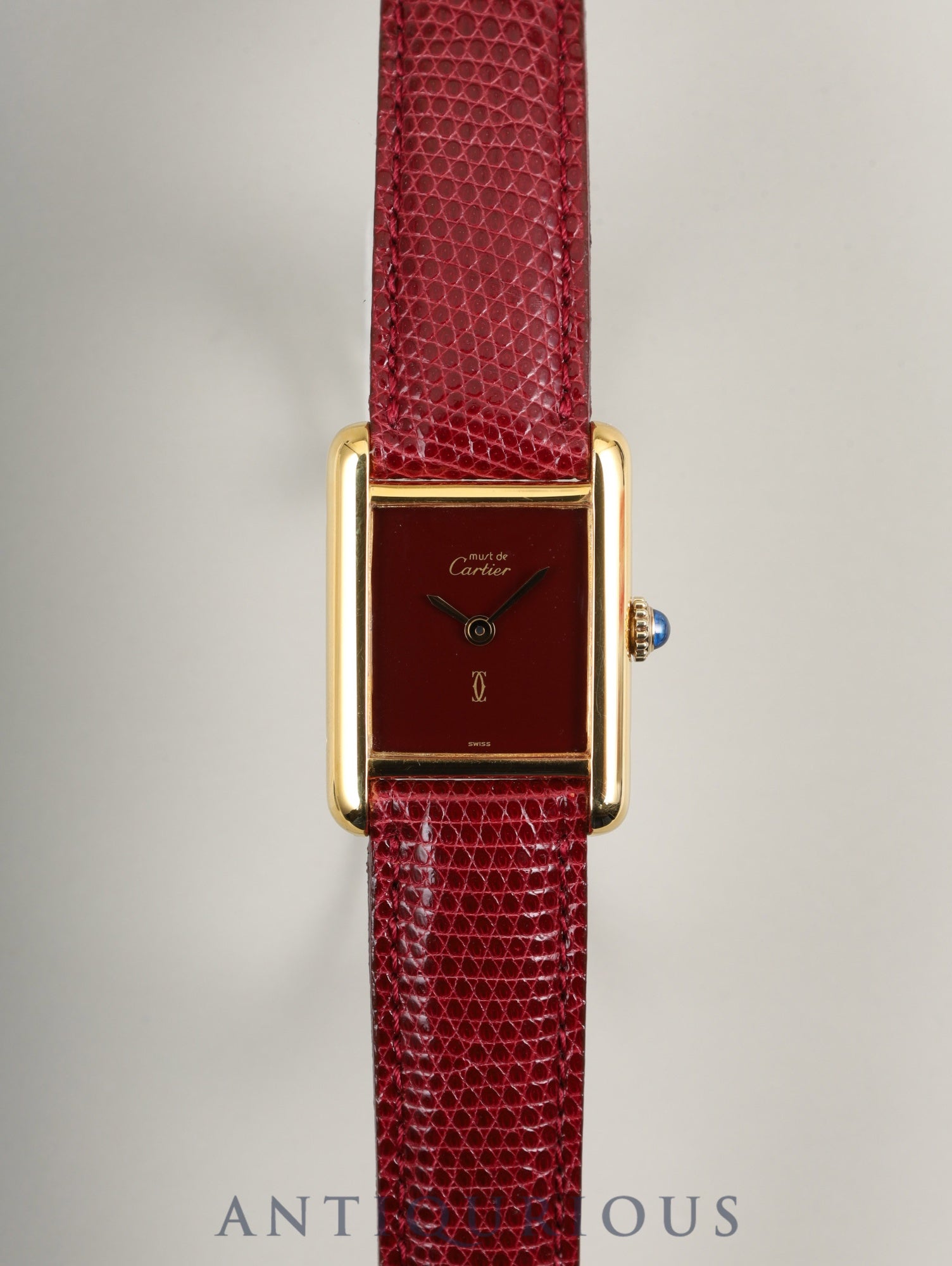 Cartier Must Tank SM, manual winding, SV925, leather, genuine buckle (GP), Bordeaux dial, garnet dial, box, booklet, international lifetime warranty (1984), fully serviced at a Cartier boutique