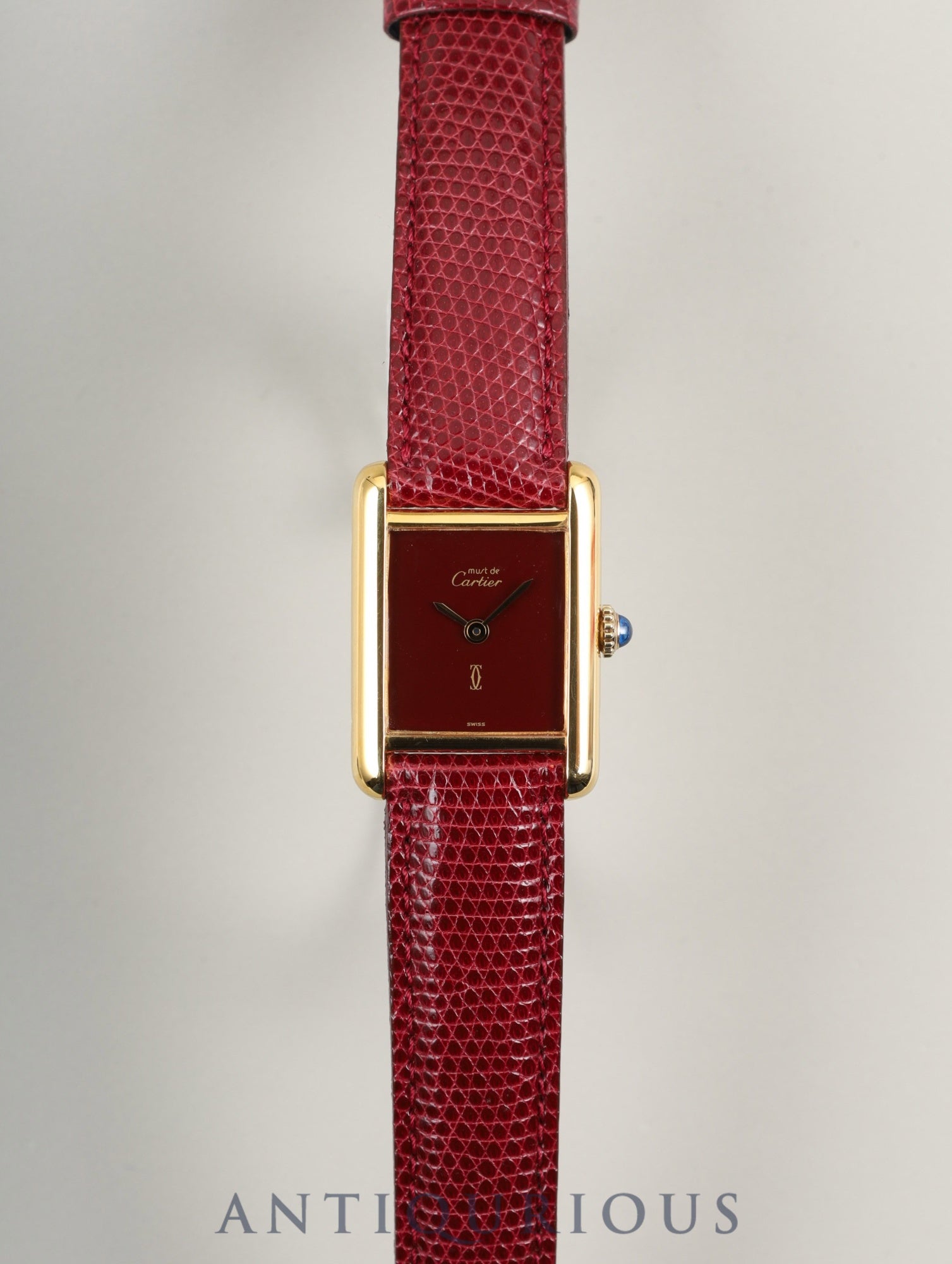Cartier Must Tank SM, manual winding, SV925, leather, genuine buckle (GP), Bordeaux dial, garnet dial, box, booklet, international lifetime warranty (1984), fully serviced at a Cartier boutique