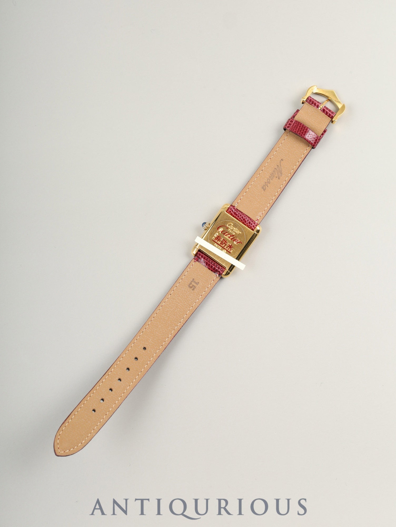 Cartier Must Tank SM, manual winding, SV925, leather, genuine buckle (GP), Bordeaux dial, garnet dial, box, booklet, international lifetime warranty (1984), fully serviced at a Cartier boutique